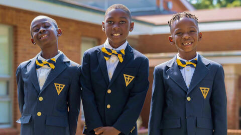 Students standing in front of school.