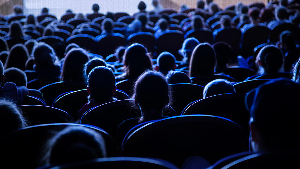 crowd seated in a theatre