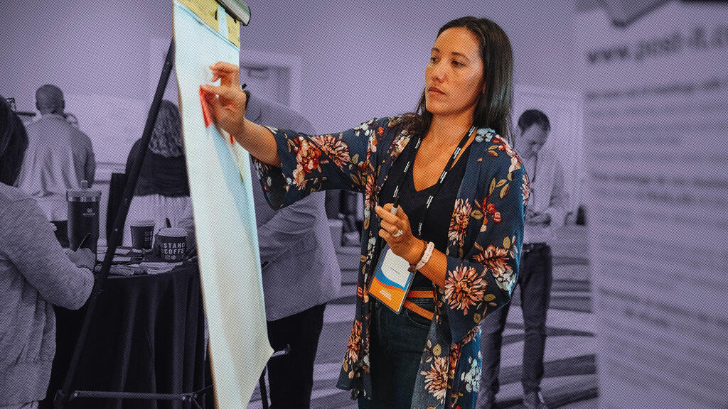woman working on giant white pad