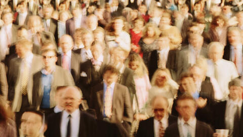 Blurry image of a large group of people.