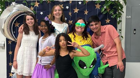 Kids posing for a group photo.