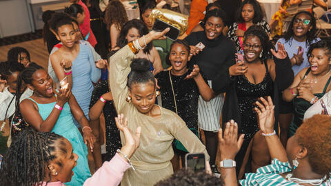 Group of teen girls dancing together.