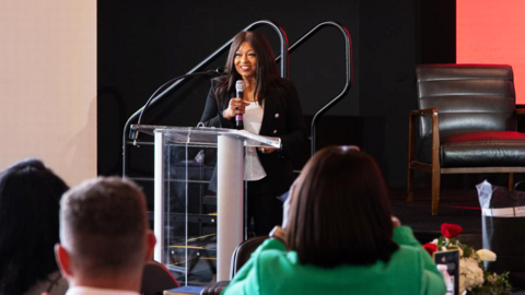 Woman speaking at an event.