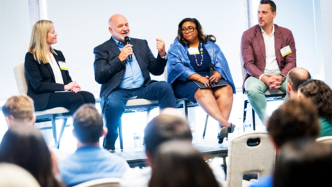 Panel speaking at an event.