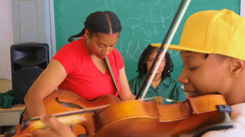 People practicing playing musical instruments.