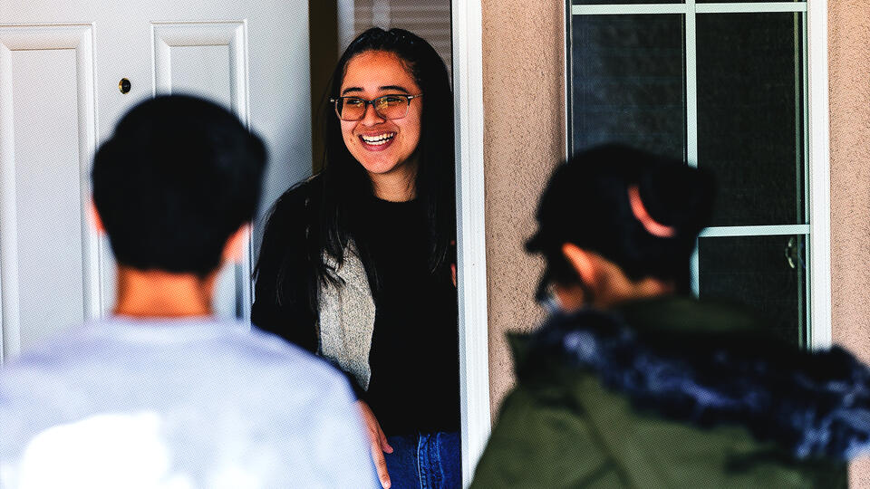 People greeting a resident