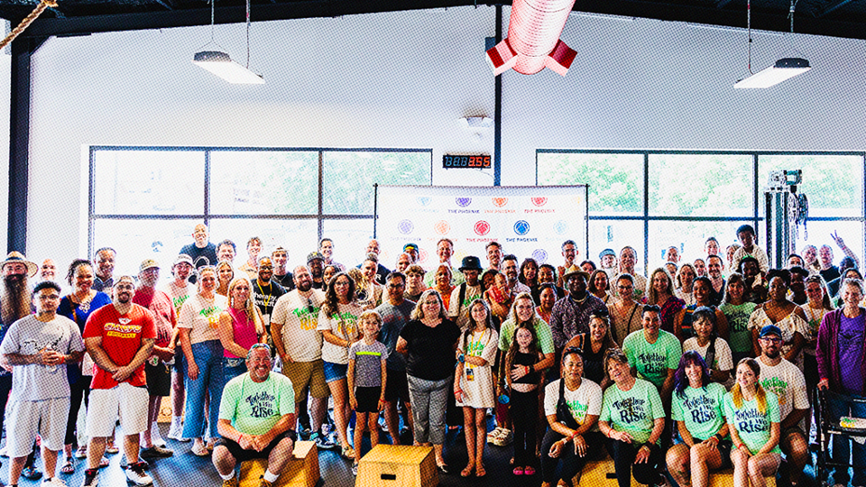 Big group of adults and children in a gymnasium