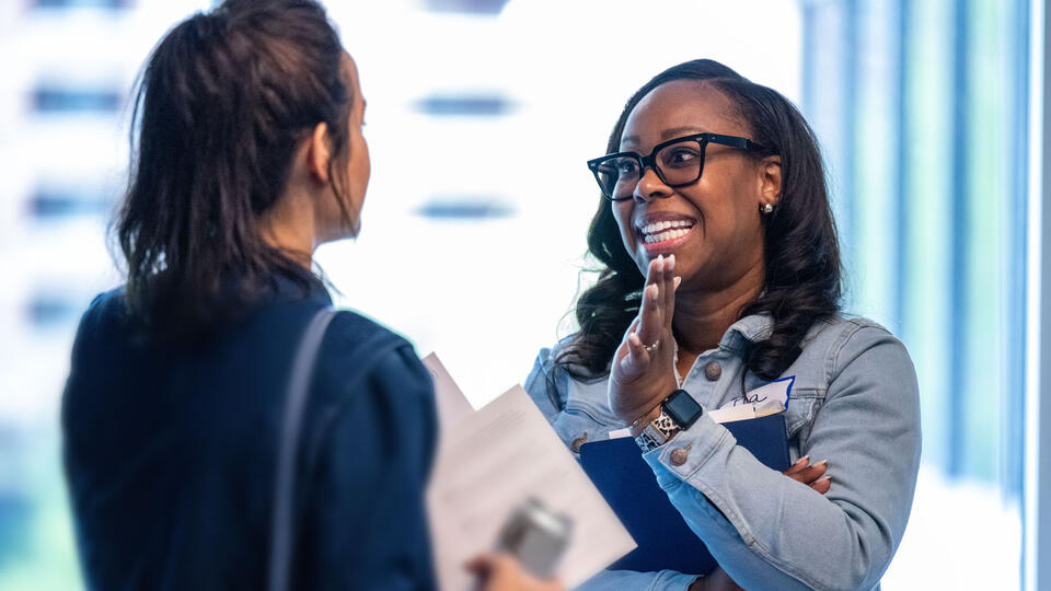 Two women talking in an office