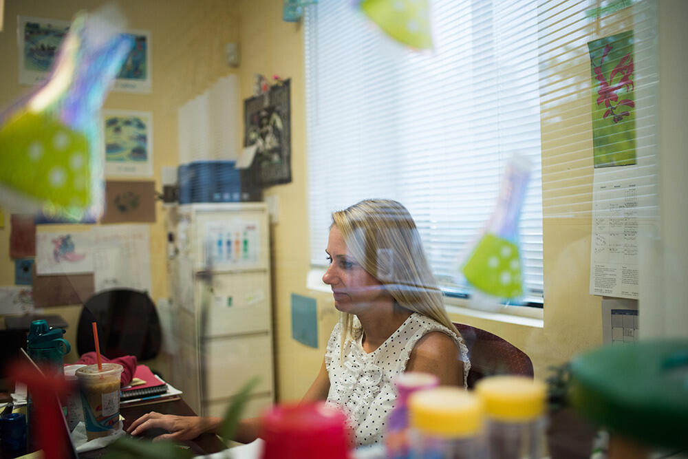 Kim Baker, Director of Kidstretch working in her ofice