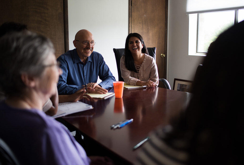 A group of people in a meeting