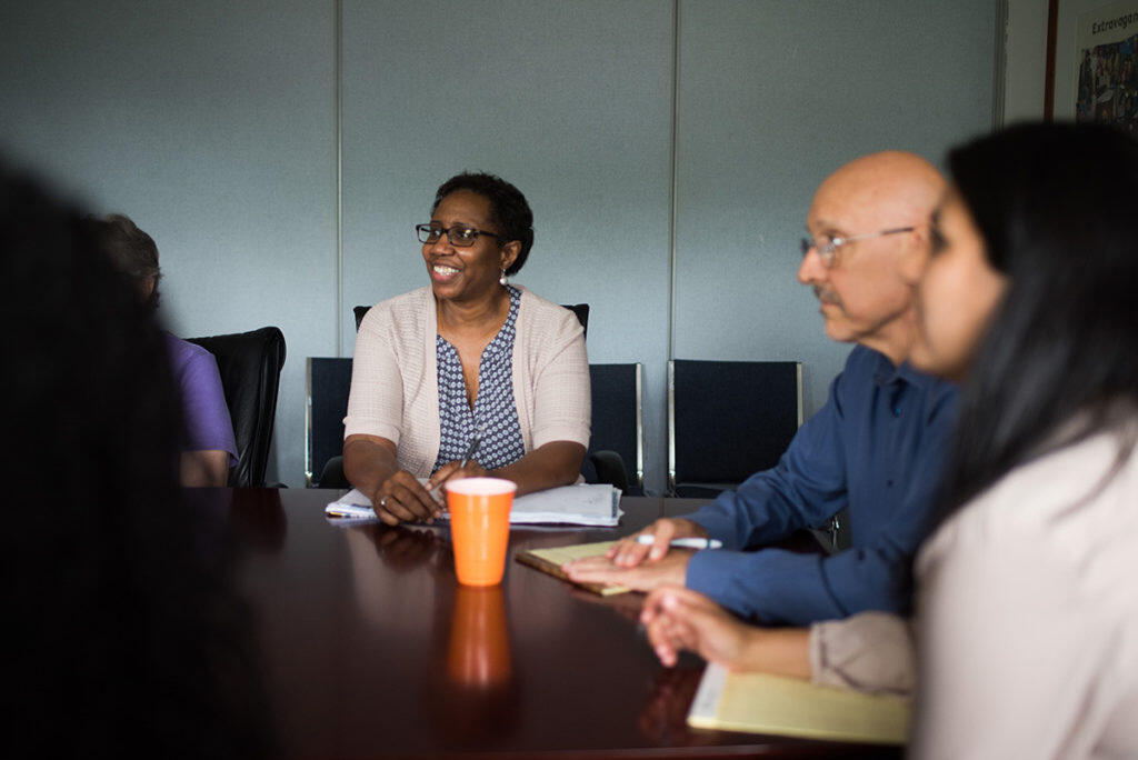 A group of people in a meeting